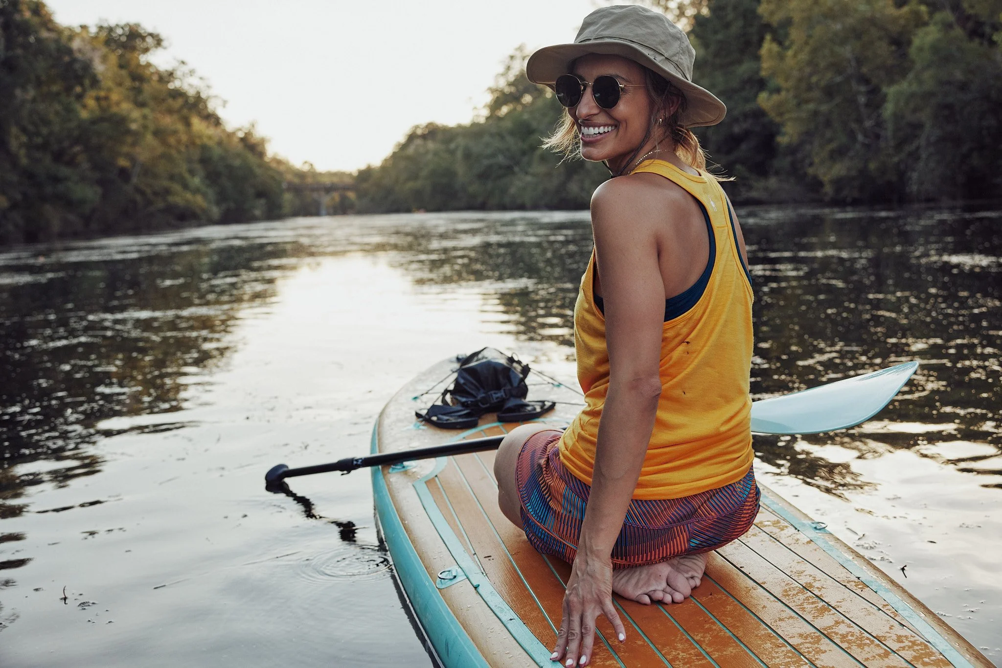 Woman paddleboarding on the river in Austin, Smartwool Spring 2021 campaign, photography by Dag Larson