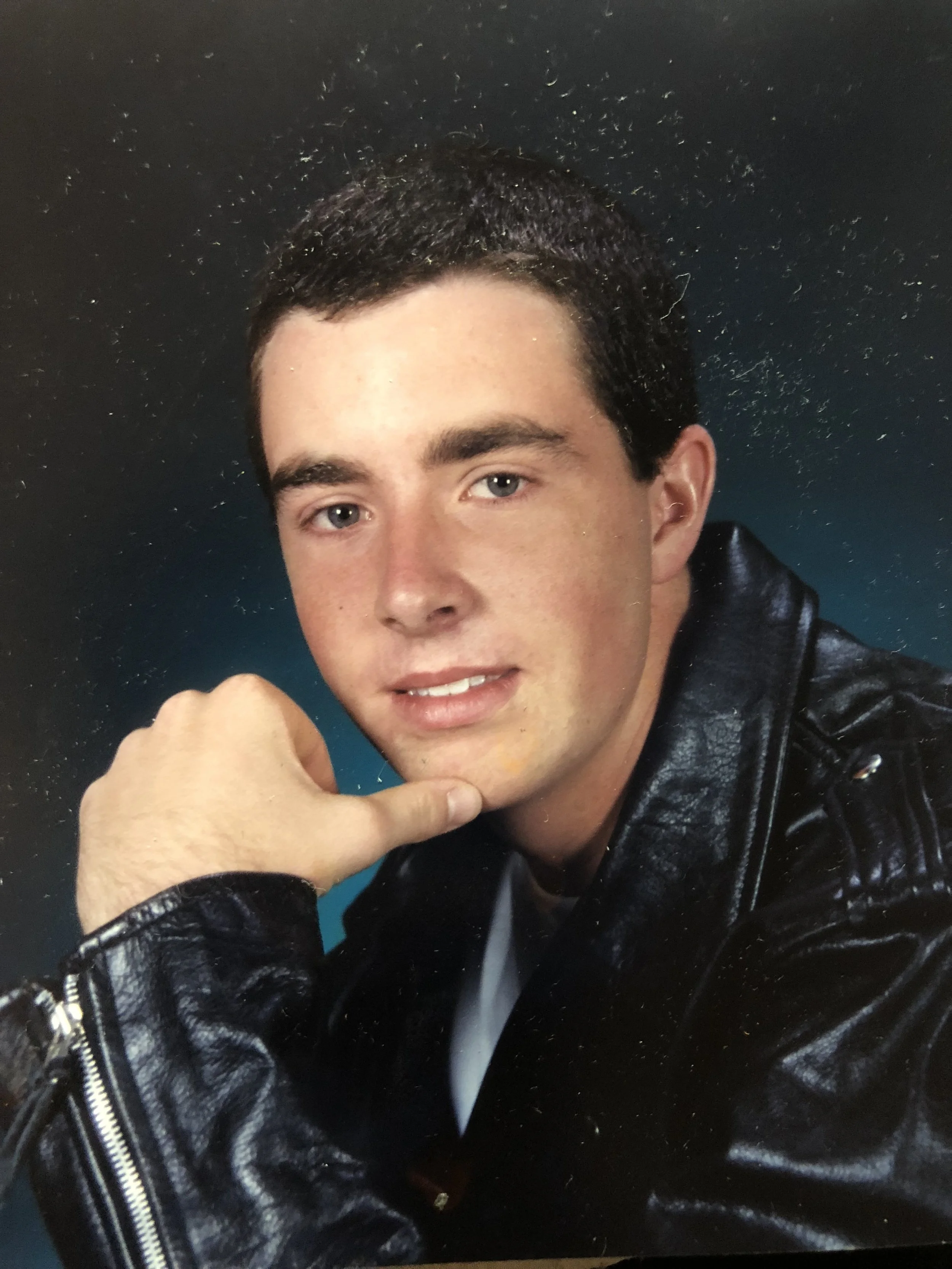 High school portrait of Dag Larson in a leather jacket