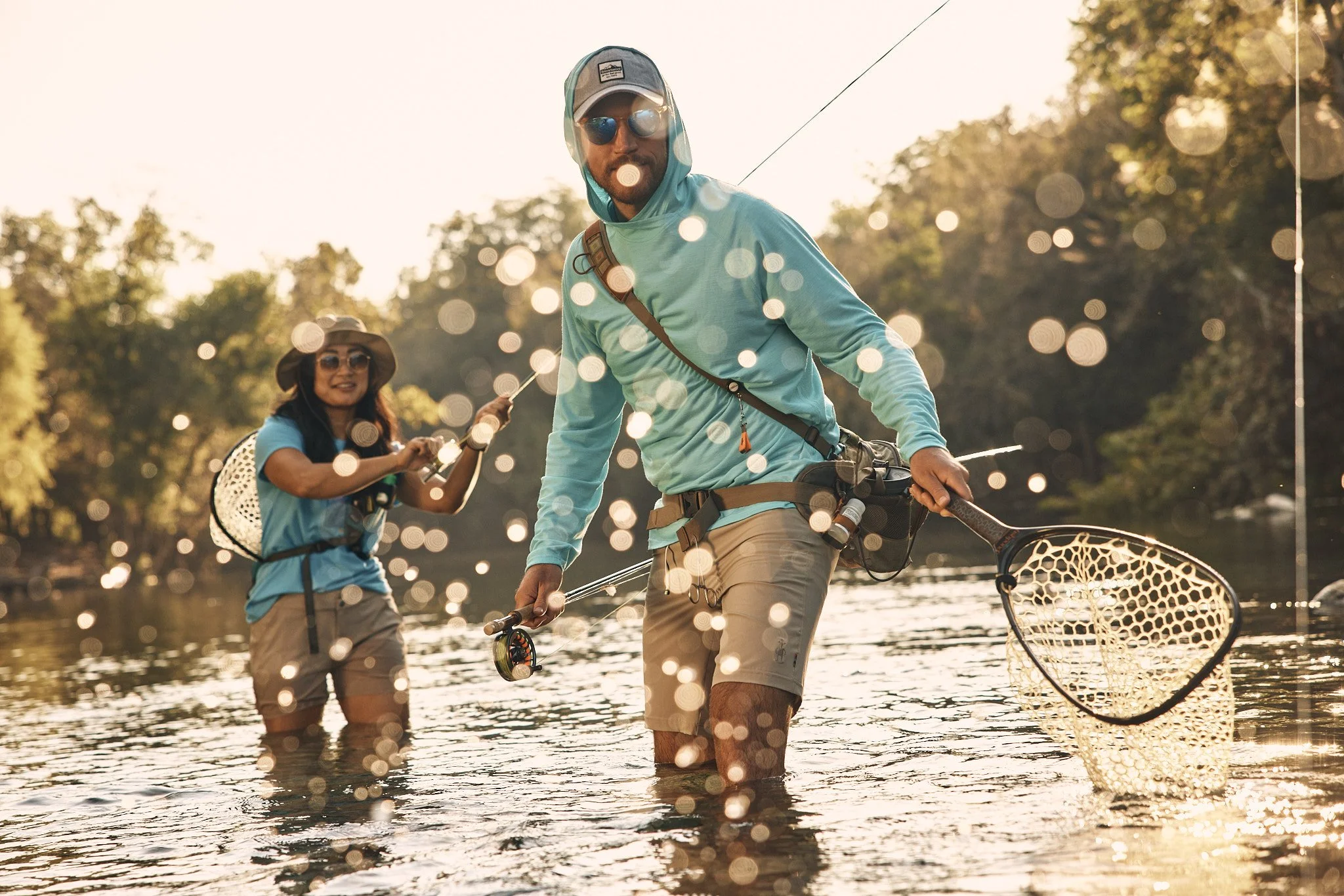 Angler netting a fish while fly fishing near Austin, Smartwool Spring 2021 campaign, photography by Dag Larson