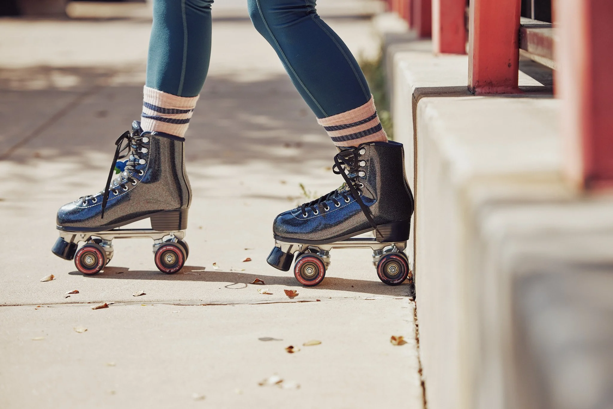 Close up of roller skates on an Austin sidewalk, Smartwool Spring 2021 campaign, photography by Dag Larson