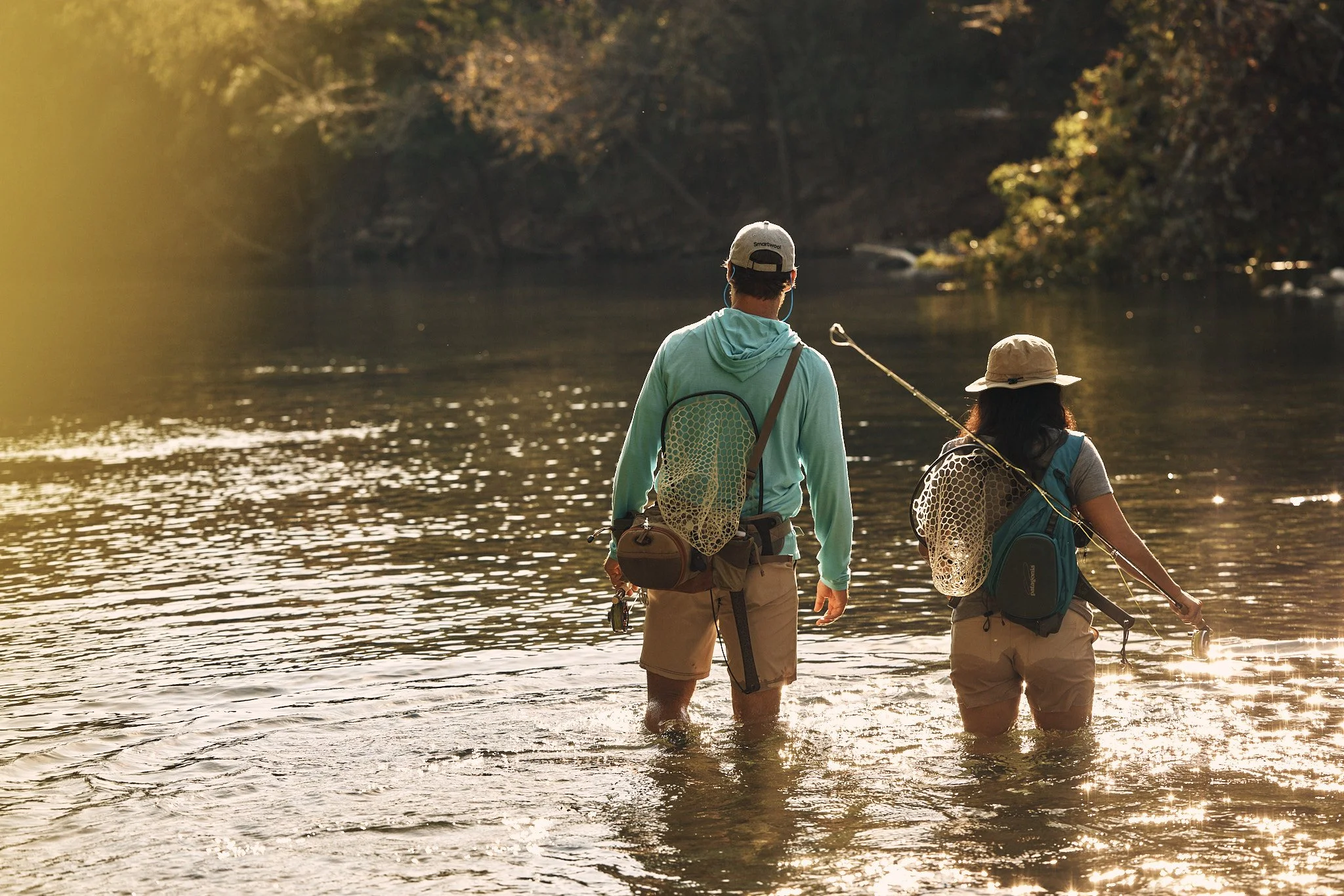 Two anglers wading a backlit river near Austin, Smartwool Spring 2021 campaign, photography by Dag Larson