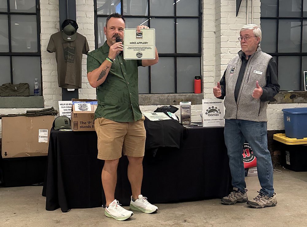 Our Executive Director, Aric W Manning, honoring the Chair of the TFNU Board, Mike Appleby, for all of his exceptional dedication and positive changes he has made while serving on our board.