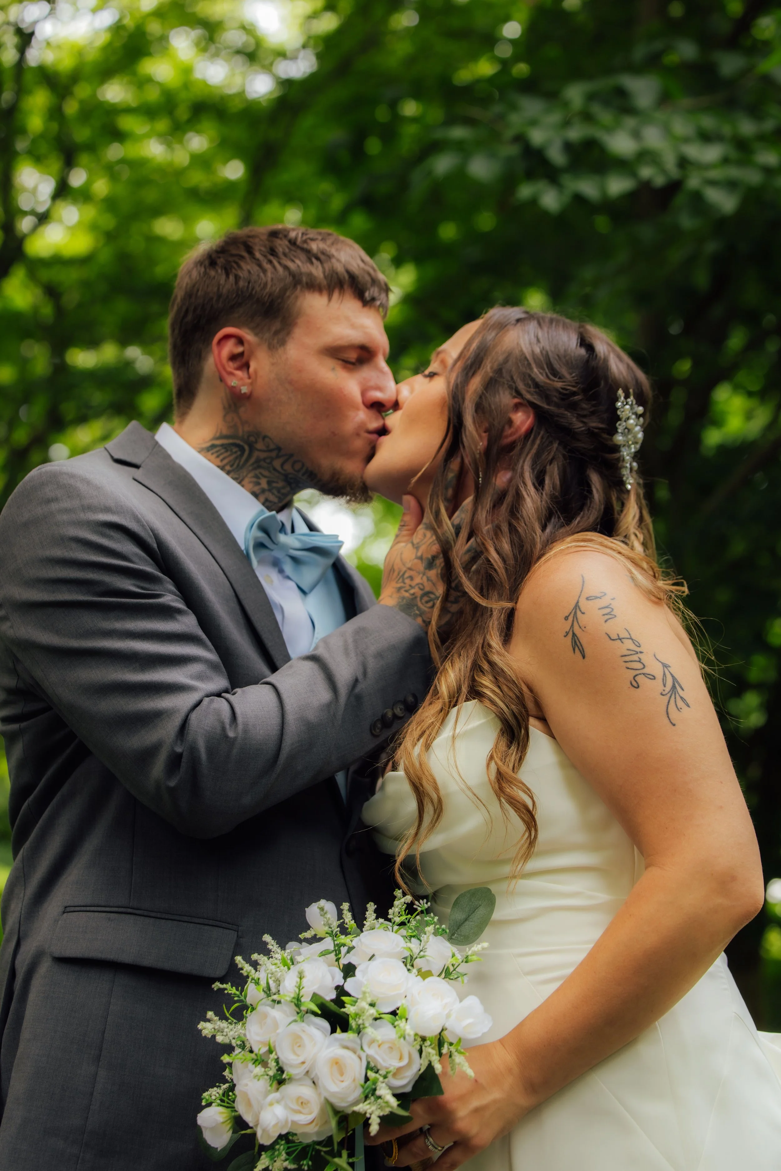 Tyler and Andrea sharing a kiss during their Fernwood wedding