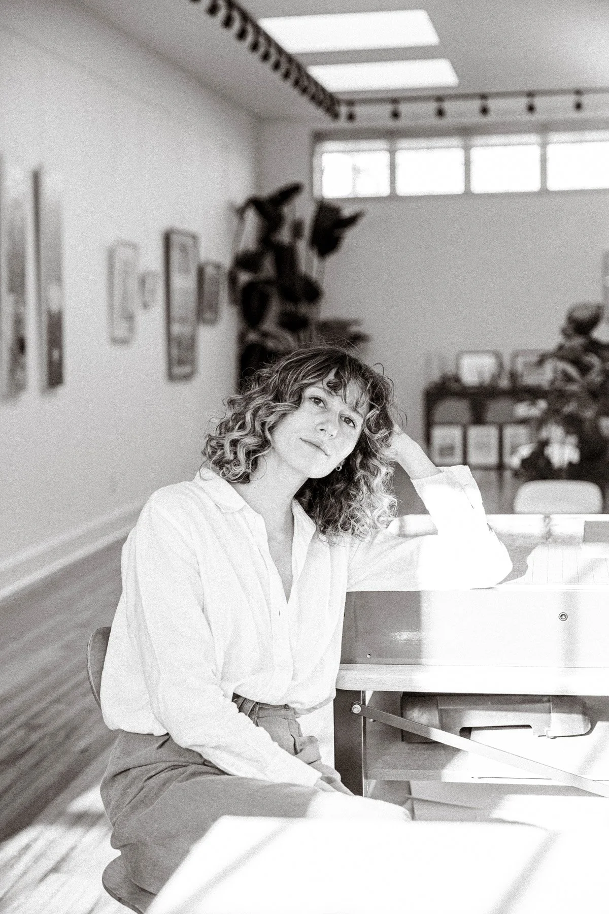 This is a portrait of Anna Bryant, a visual artist and printmaker in Western North Carolina. Anna works with intaglio ink on a mesh screen to create abstract brutalist and architectural prints.