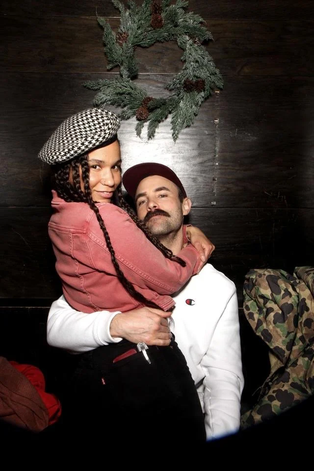 dustin and natasha in a photo booth in portland, oregon