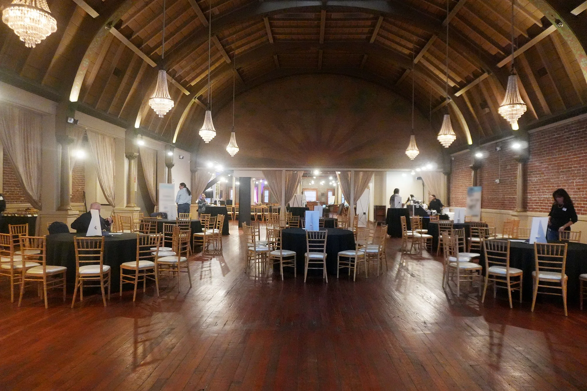 Venue interior with Natural Wood Chiavari Chairs set up for an event.
