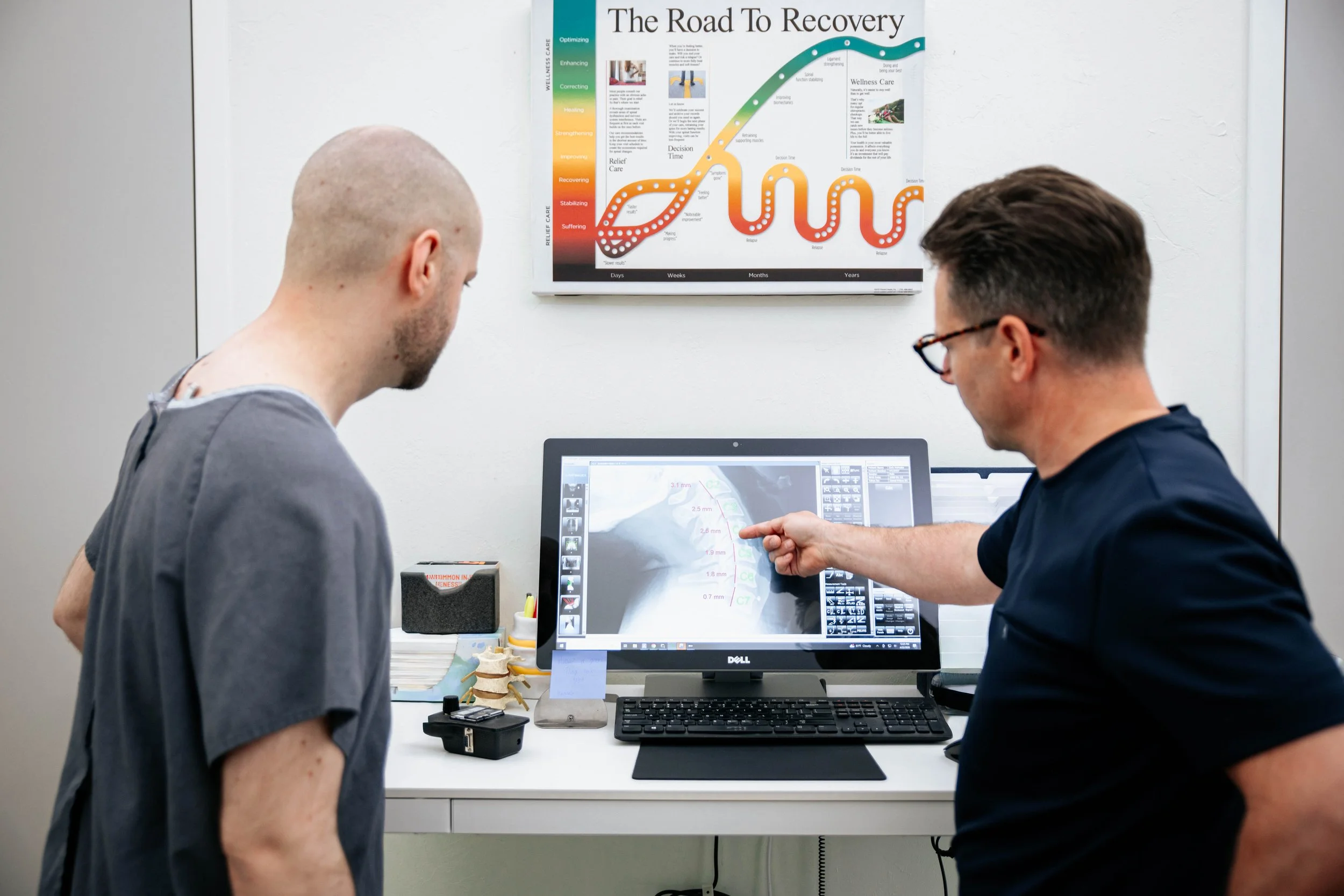 Dr. Prince reviewing x-rays with a patient