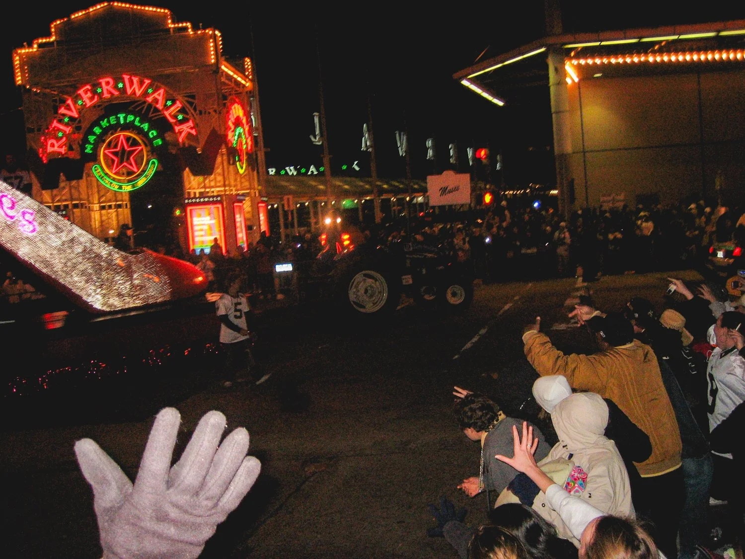Saints kicker, Garret Hartley, gets off of the Krewe of Muses' shoe float.