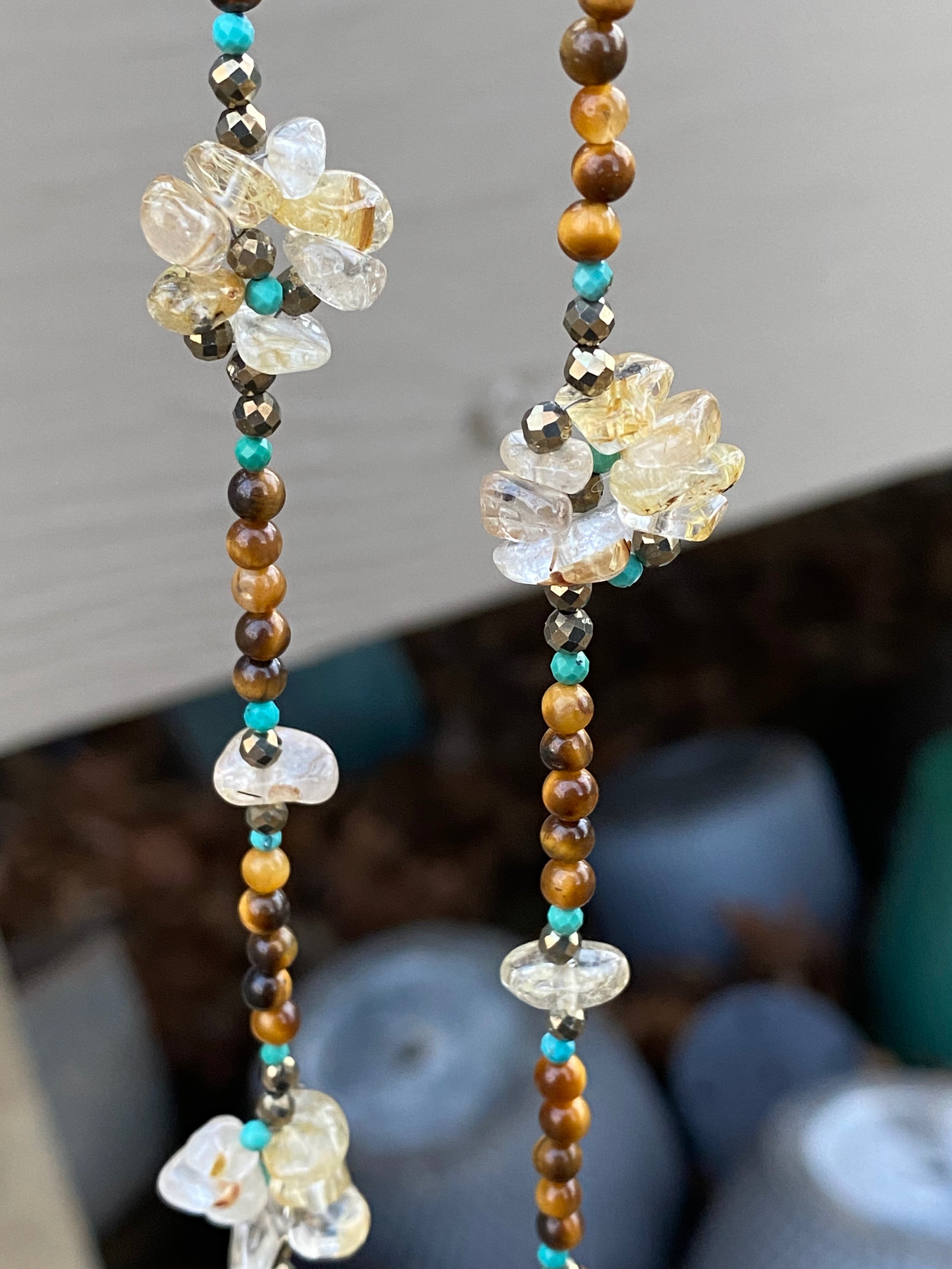 Apatachi handcrafted jewelry bohemian necklace. Rutilated Quartz Wildflowers with Tiger’s Eye, Hubei Turquoise and Pyrite long necklace