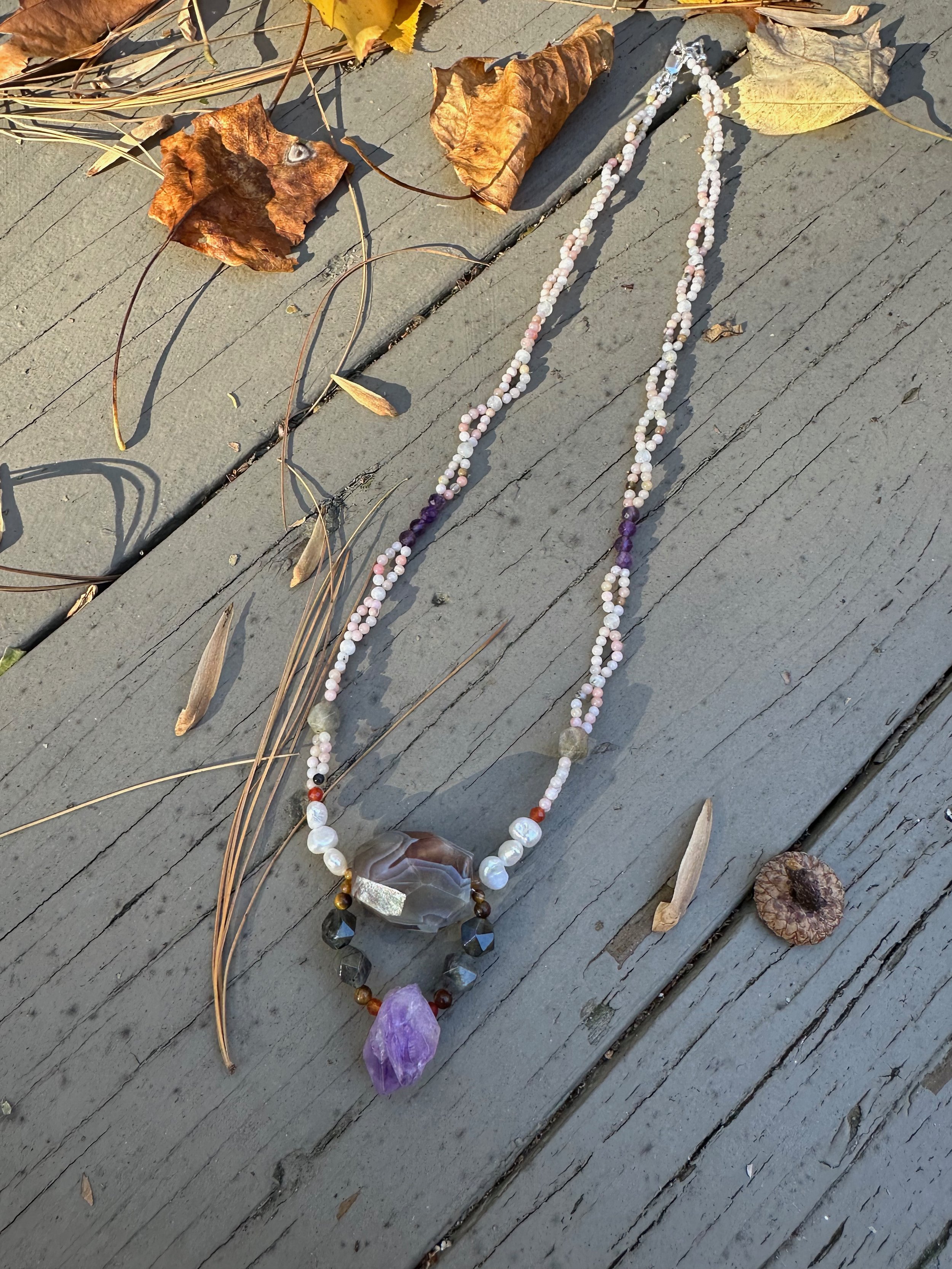 Apatachi handmade necklace. Bold centerpiece with faceted amethyst and agate on a woven pink opal necklace