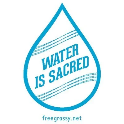 A drop of water that reads Water is Sacred
