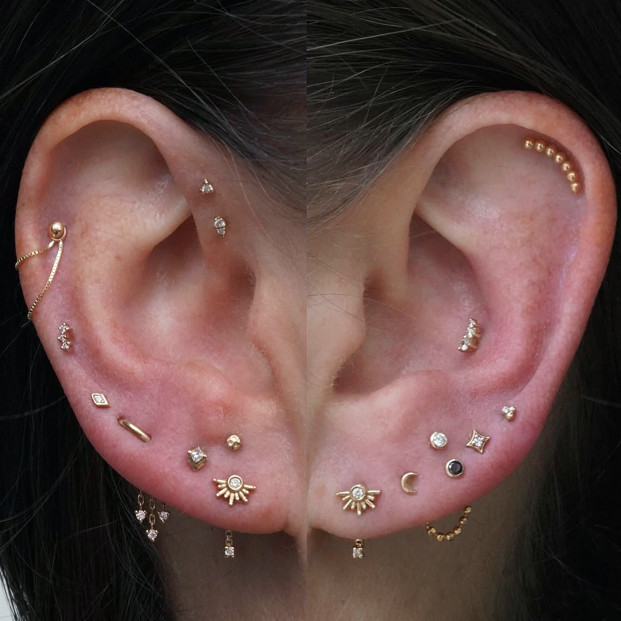 A pair of ears with a full styling of small studs, mostly across the lobes.