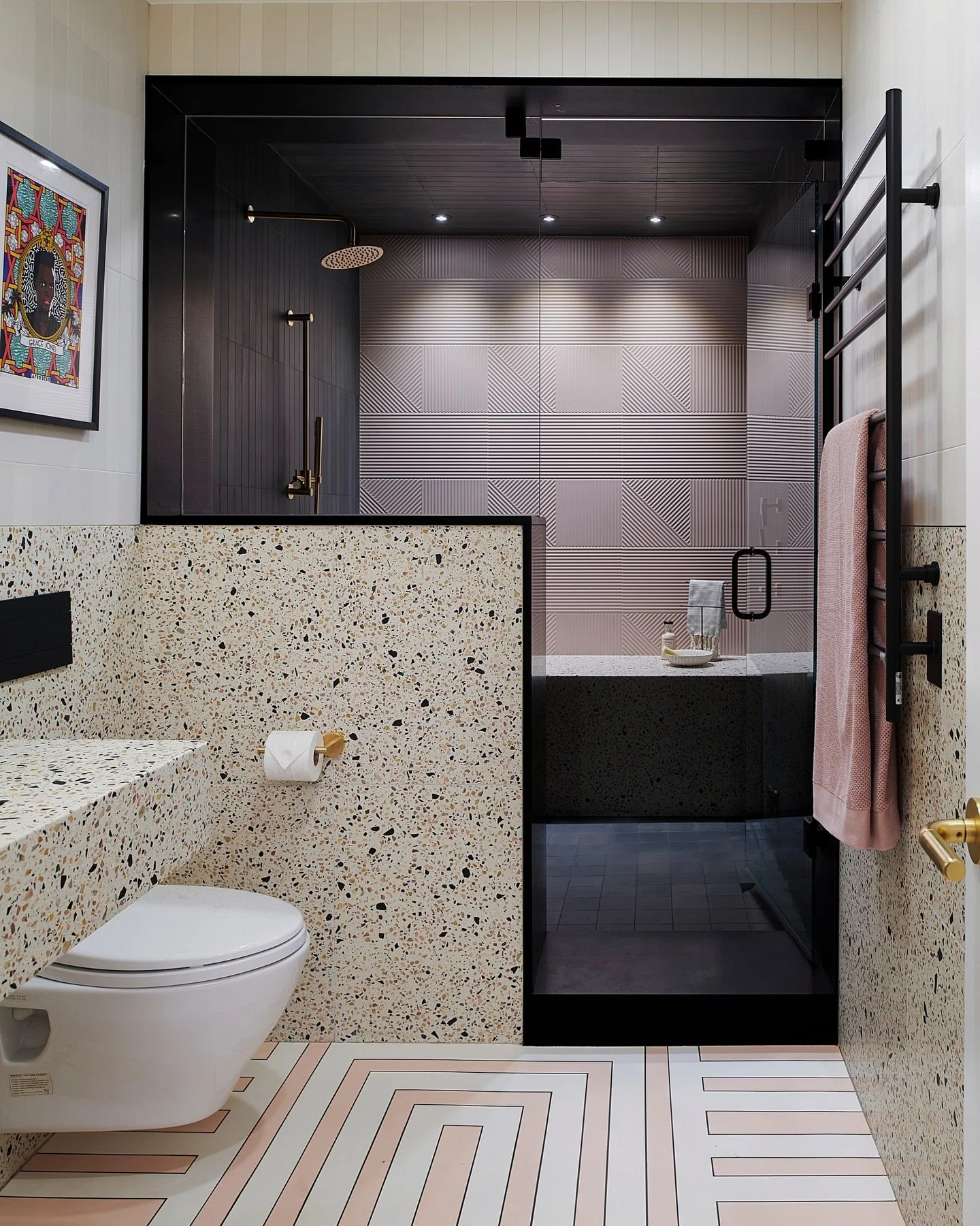 Project Wolverleigh&rsquo;s boutique-inspired guest bath is all I&rsquo;ve been able to think about this month...⁠
⁠
Complementary dusty pinks and deep browns capture the eye while brass fixtures add bright, mid-century inspired accents. Flecked with