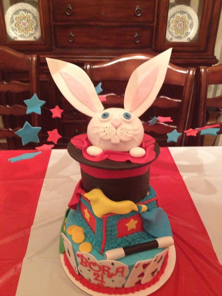 Magician themed cake with rabbit popping from top hat and fondant scarves
