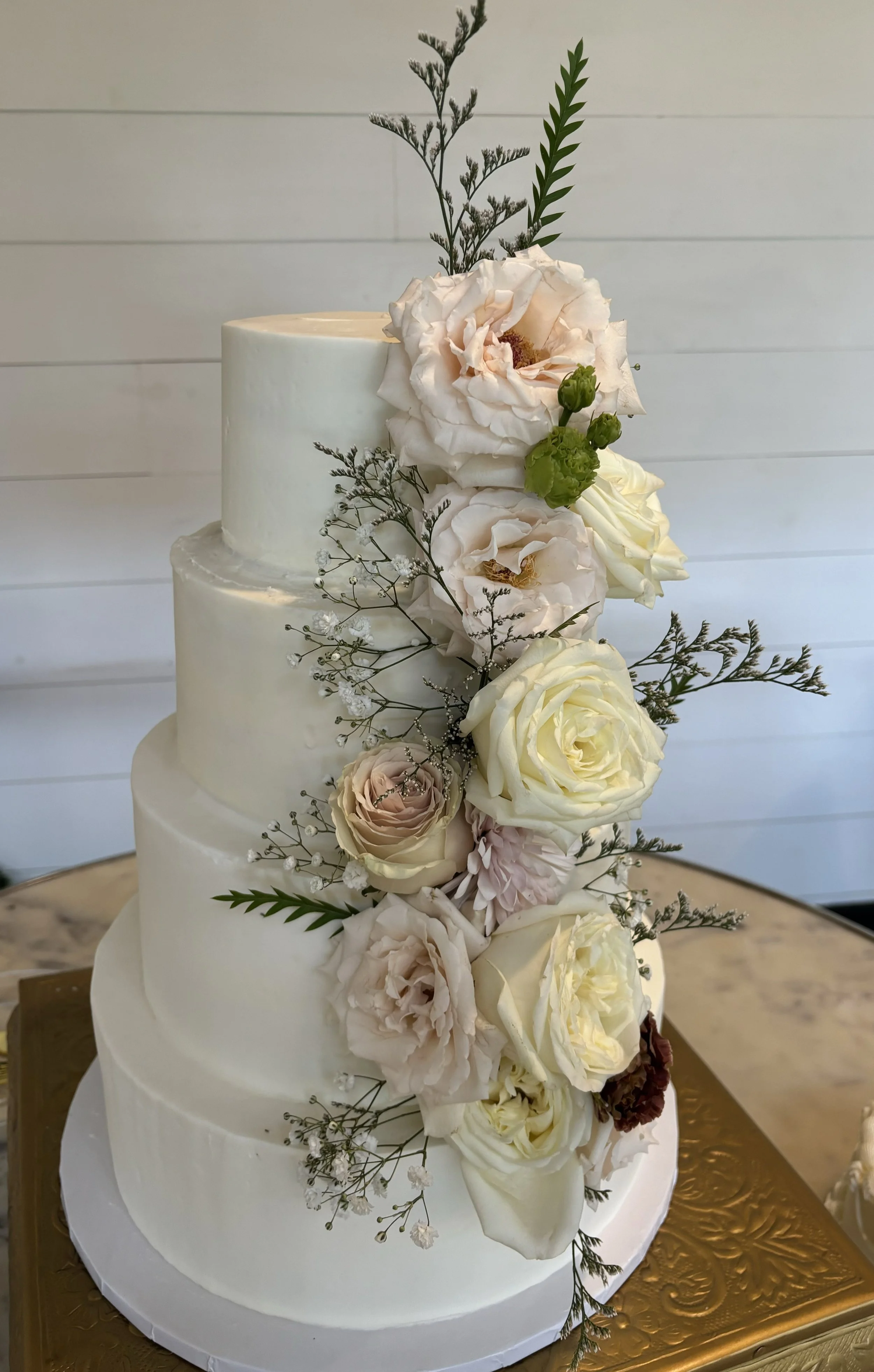 Atlanta Wedding Cakes Four tiered buttercream wedding cake with fresh flowers - Meadows at Mossy Creek wedding venue - June wedding - Artful Cakery by Julie - Flowery Branch Bakery - Custom Wedding Cake - Cleveland Georgia