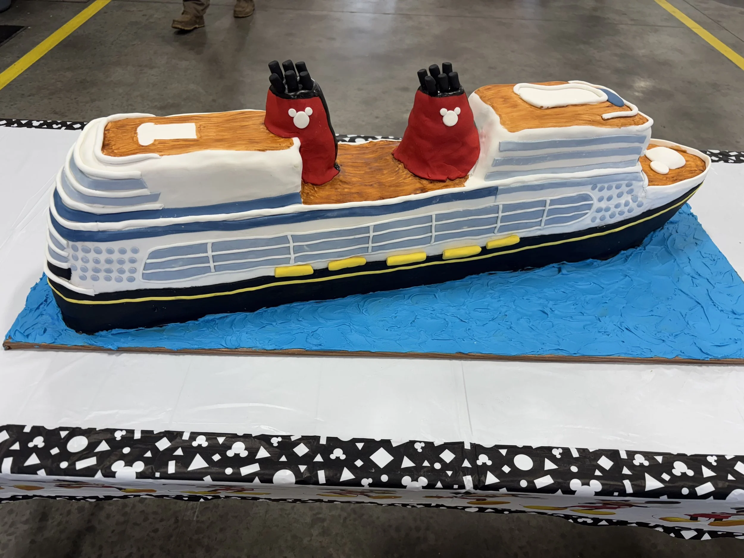 Realistic cruise ship cake designed as a dimensional maritime-themed cake.