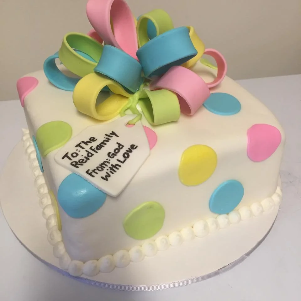 Pastel gift box cake with polka dot ribbon and fondant bow