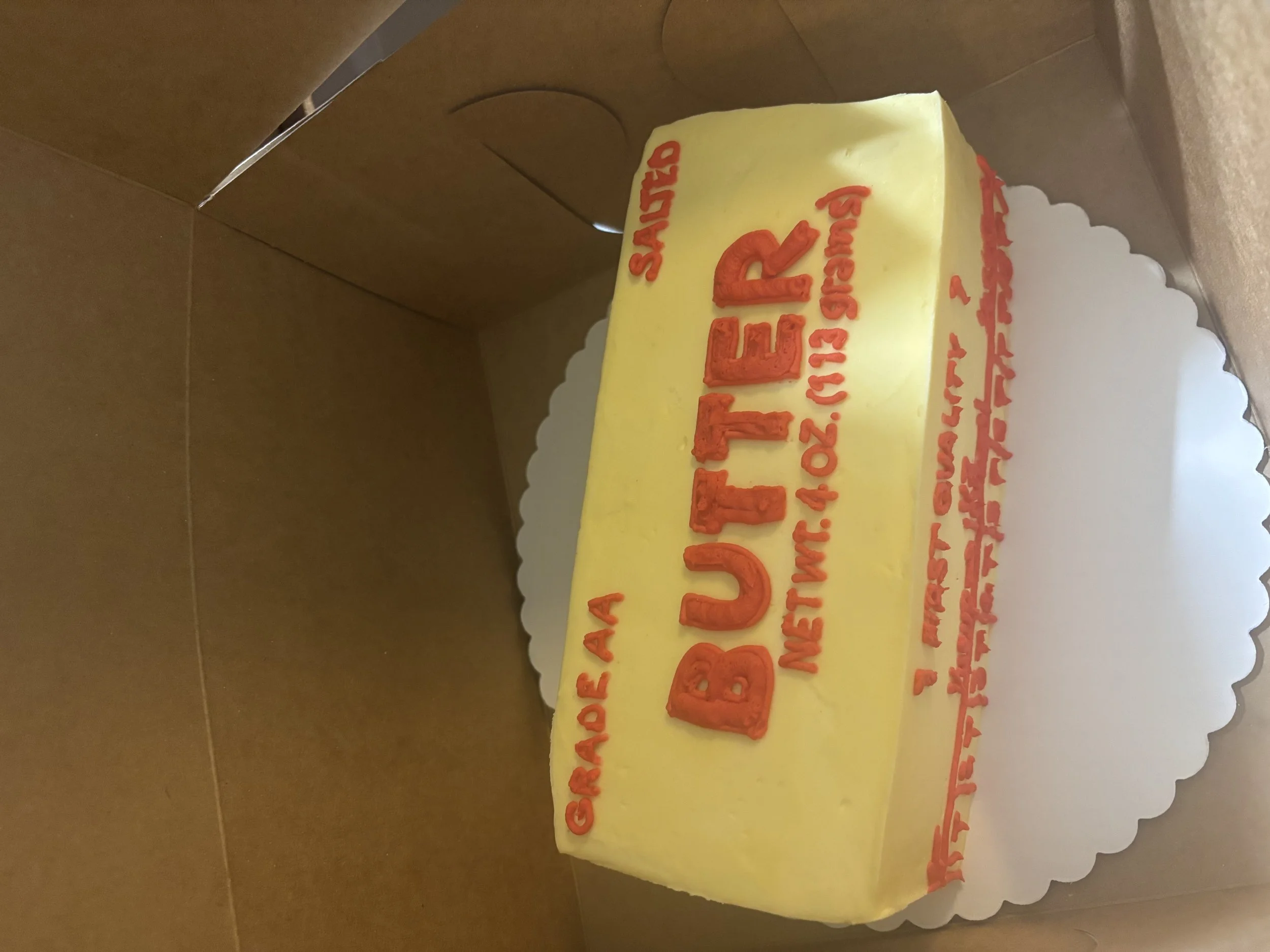 Realistic stick of butter cake designed as a playful food illusion cake.