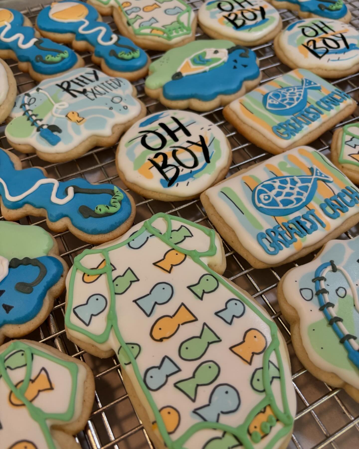 Fishing themed baby shower cookies for a boy 
.
.
.
.
#decoratedsugarcookies #babyshower #sugarcookies #flowerybranchga #royalicing #fishing #greatestcatch #fish inspiration from @sugar.rush.custom.cookies
