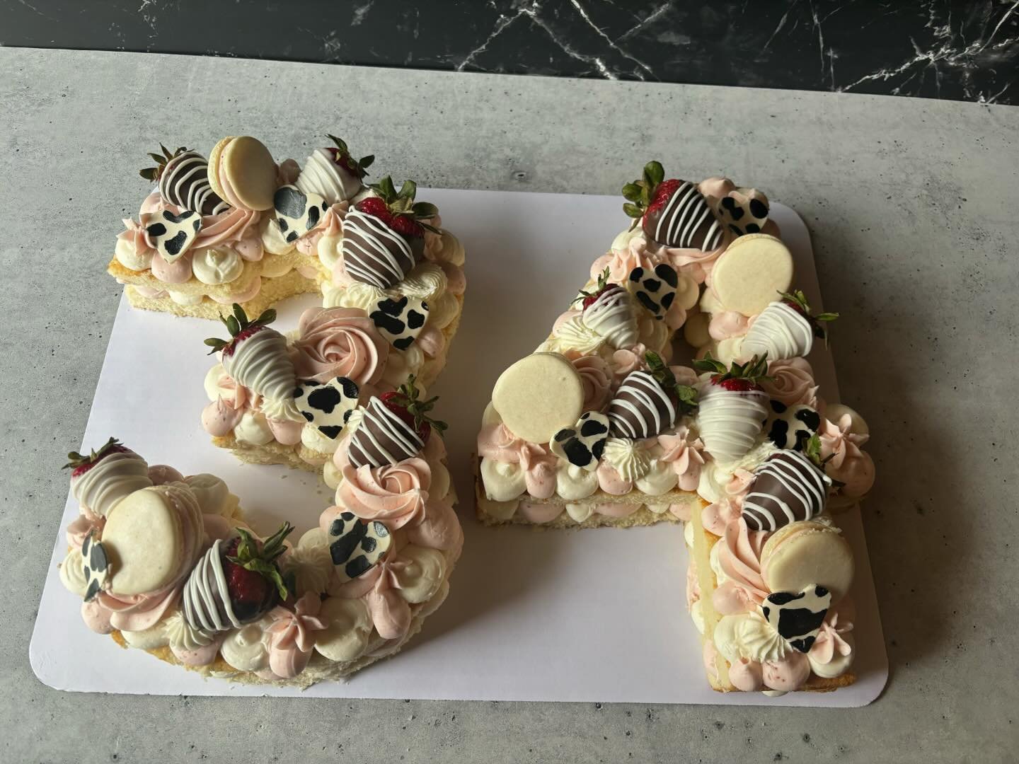 Happy 34th birthday!! 
.
.
.
.
.
#Vanilla cake #strawberrybuttercream #vanillabuttercream #modelingchocolatehearts #chocolatecoveredstrawberries #macarons #rosettes #birthdaycake #34thbirthday #birthdayparty #artfulcakerybyjulie