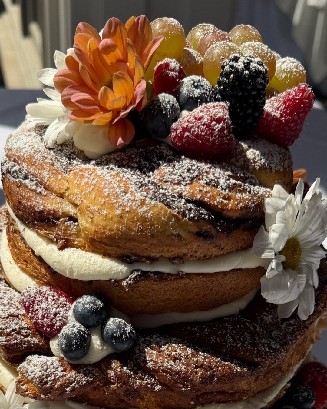 A closer look at the texture on this one ✨

This non-traditional wedding cake features layers of babka, soft cream cheese filling, and fresh fruit&mdash;designed for couples who want something just a little different. This couple is the "babka&q
