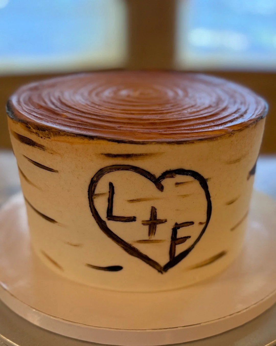 It's the carved initials for me 🤍

This tree stump cake was designed to feel meaningful and personal&mdash;perfect for a rustic or outdoor wedding.

Every detail tells a story.

Would you include something like this?

#rusticweddingcake #groomscake 