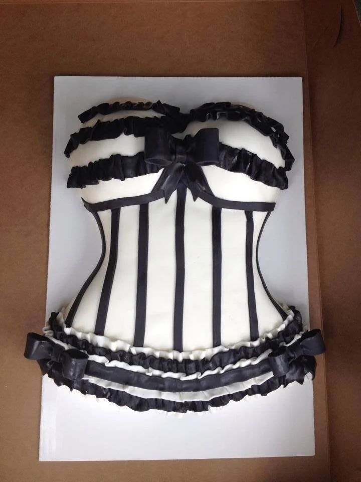 Sculpted black and white lace lingerie cake with delicate fondant detailing