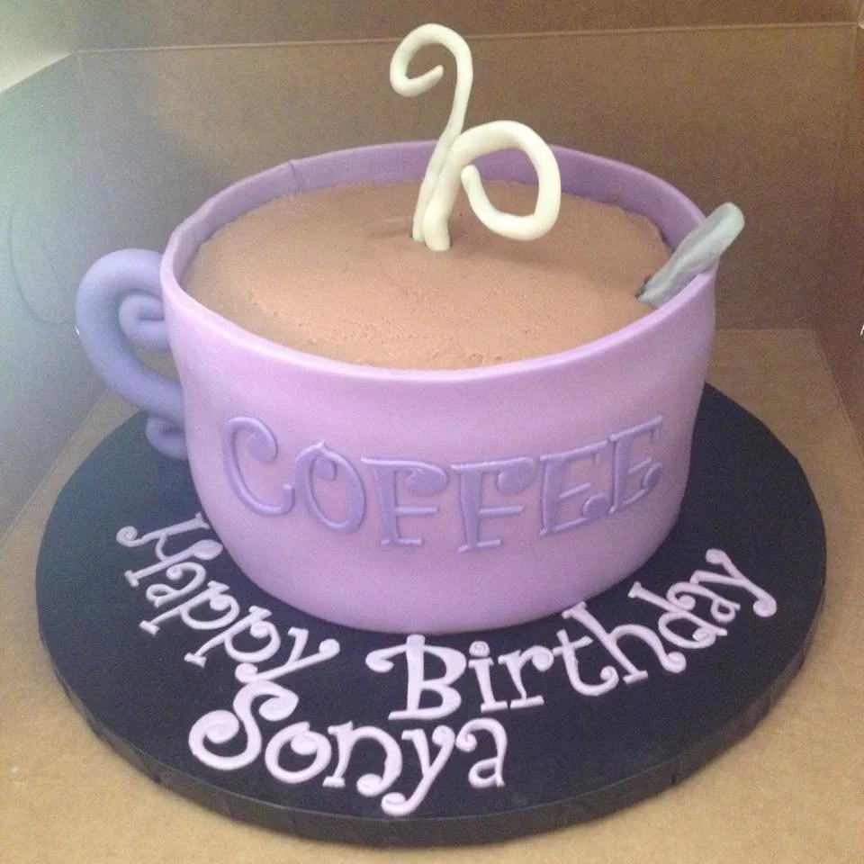 Sculpted purple coffee cup cake with latte art and edible steam detail