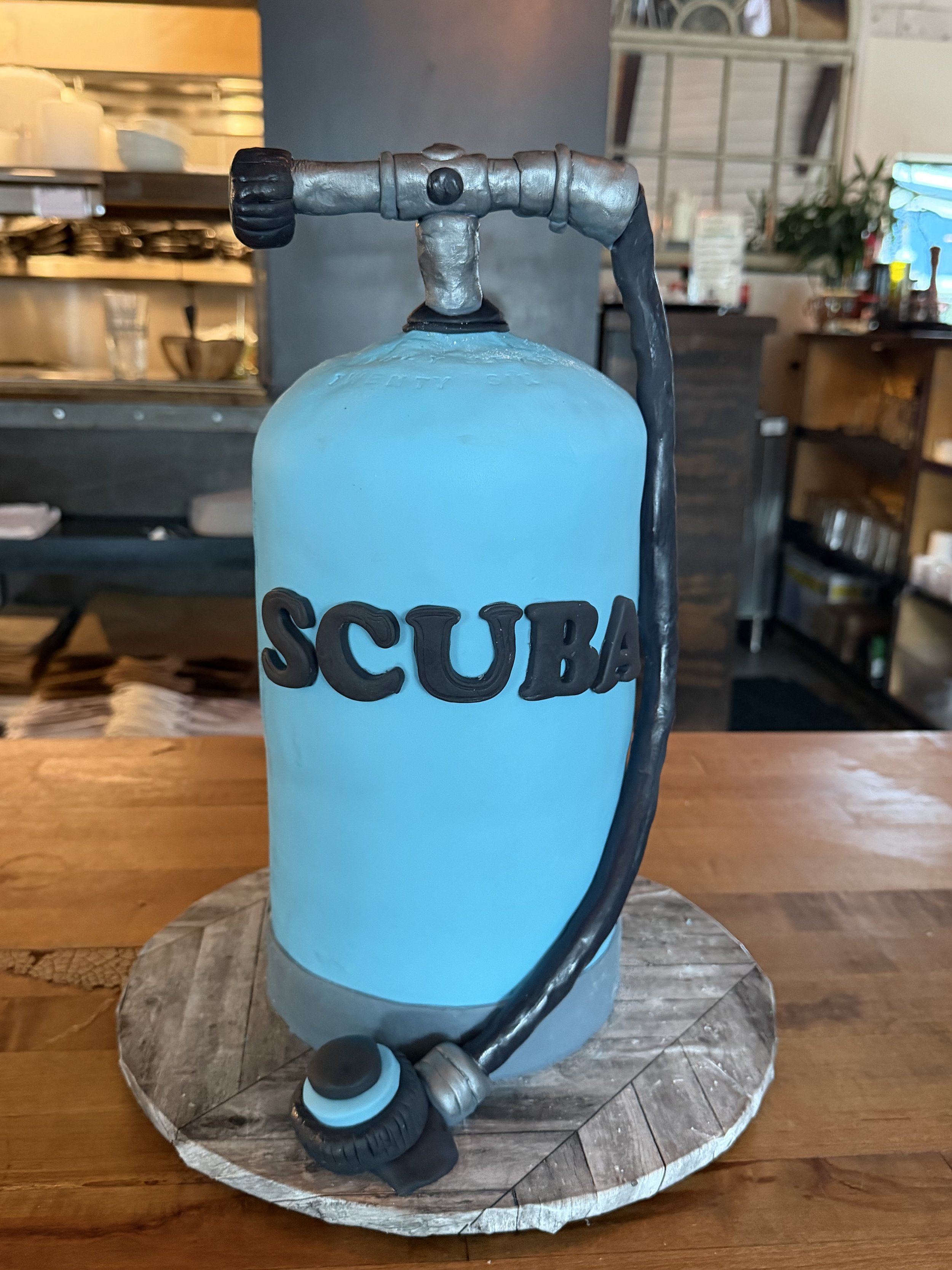 blue Scuba tank groom's cake chocolate with chocolate buttercream and covered and decorated with fondant