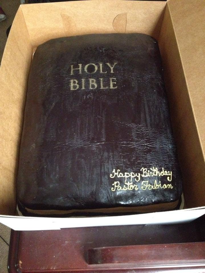 Sculpted Bible cake with gold edged pages and embossed cross detail