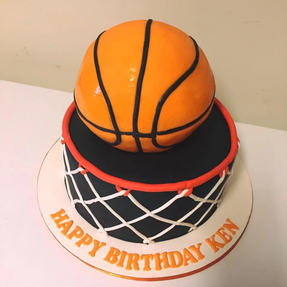 Gravity defying basketball cake going through edible hoop and net