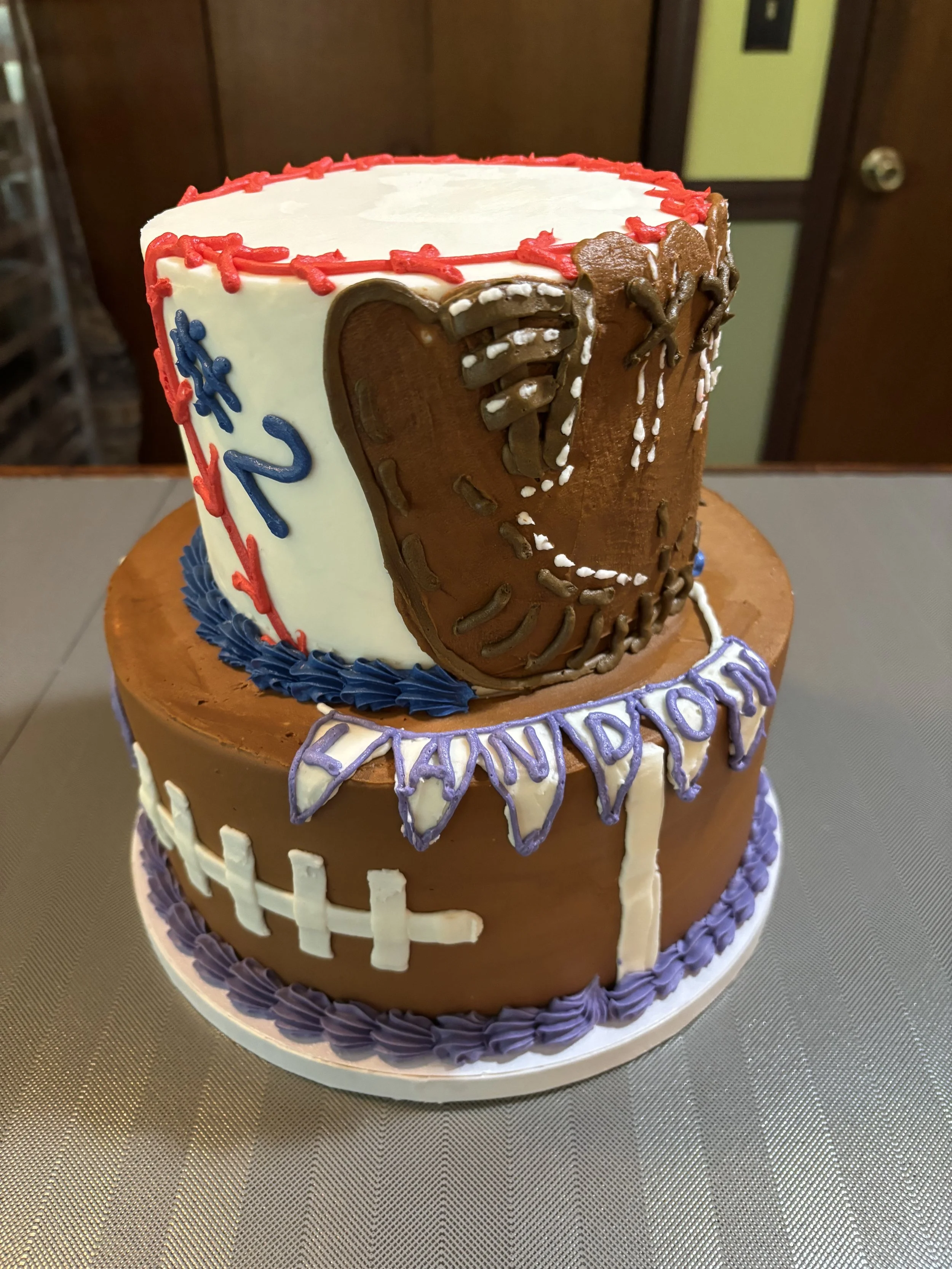 Sports themed birthday cake celebrating multiple favorite sports.