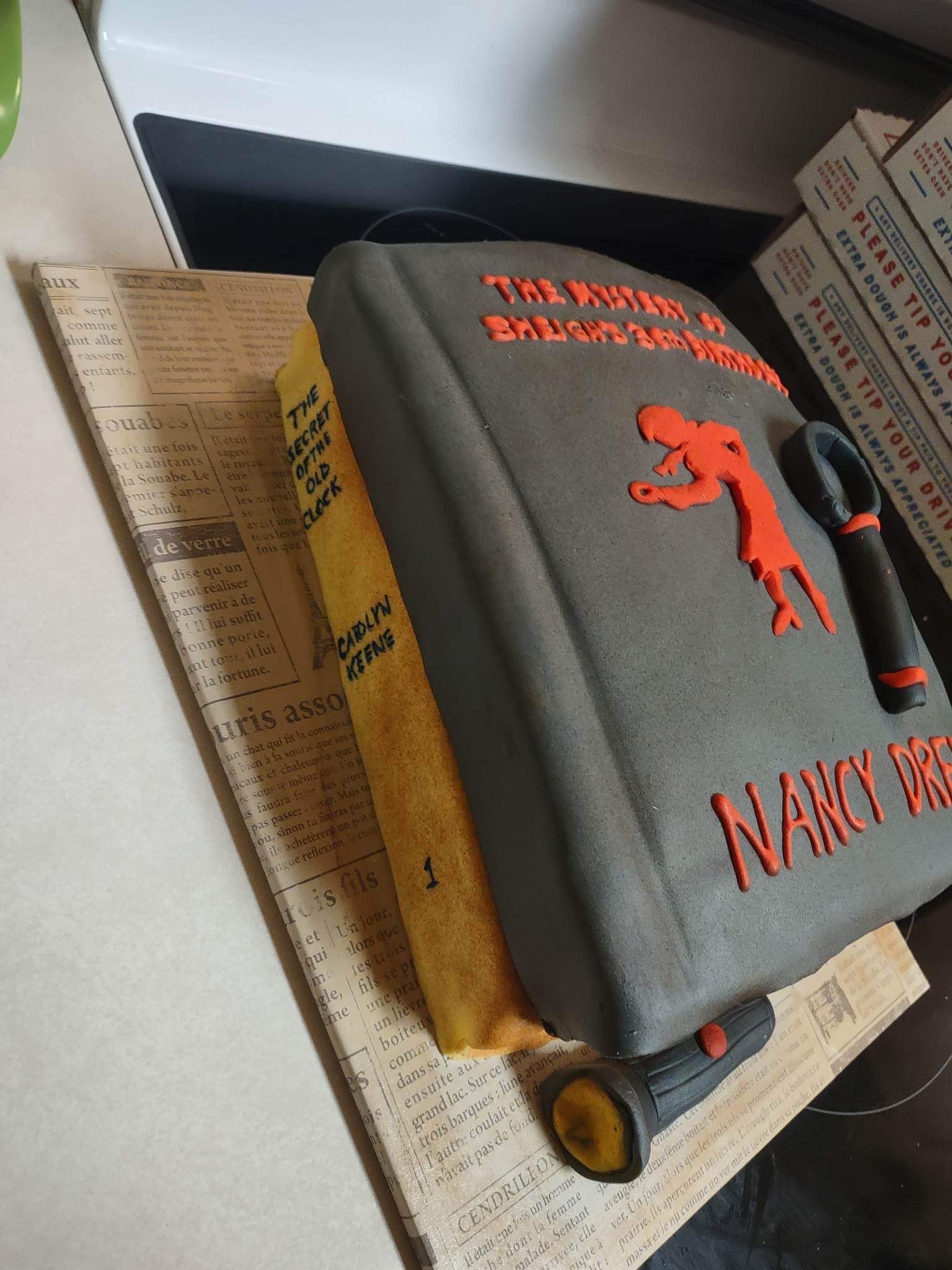 Stack of Nancy Drew books cake designed for mystery lovers and book-themed celebrations.