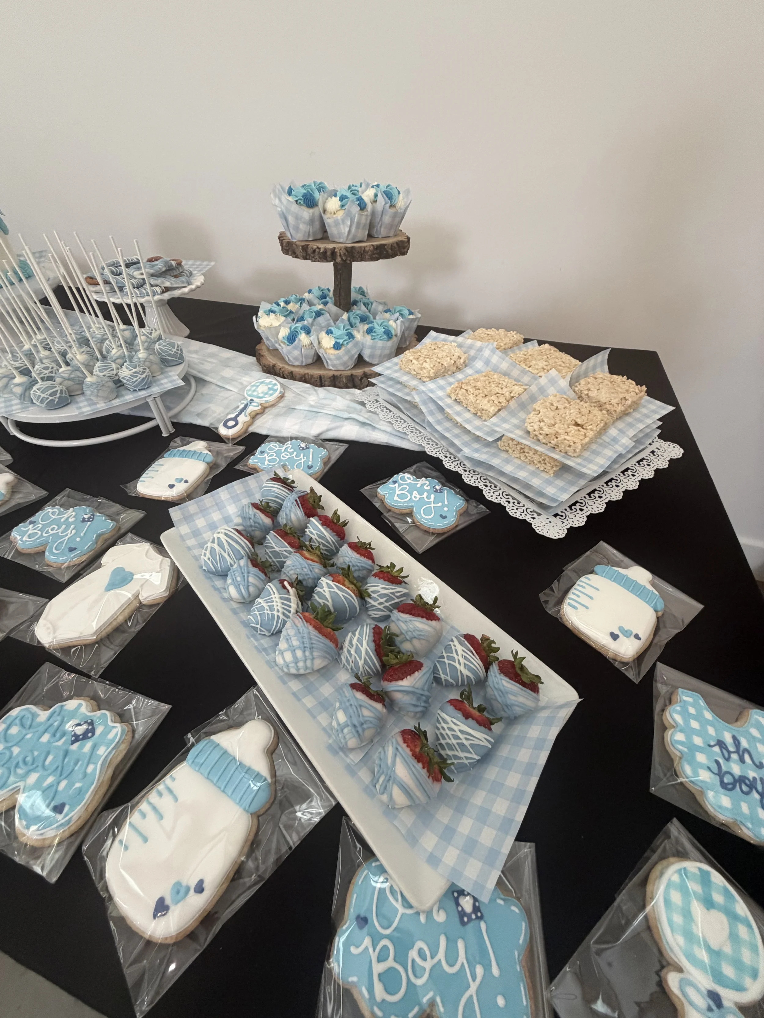 chocolate covered strawberries, decorated cookies, rice crispy treats, cupcakes, cake pops for baby boy shower
