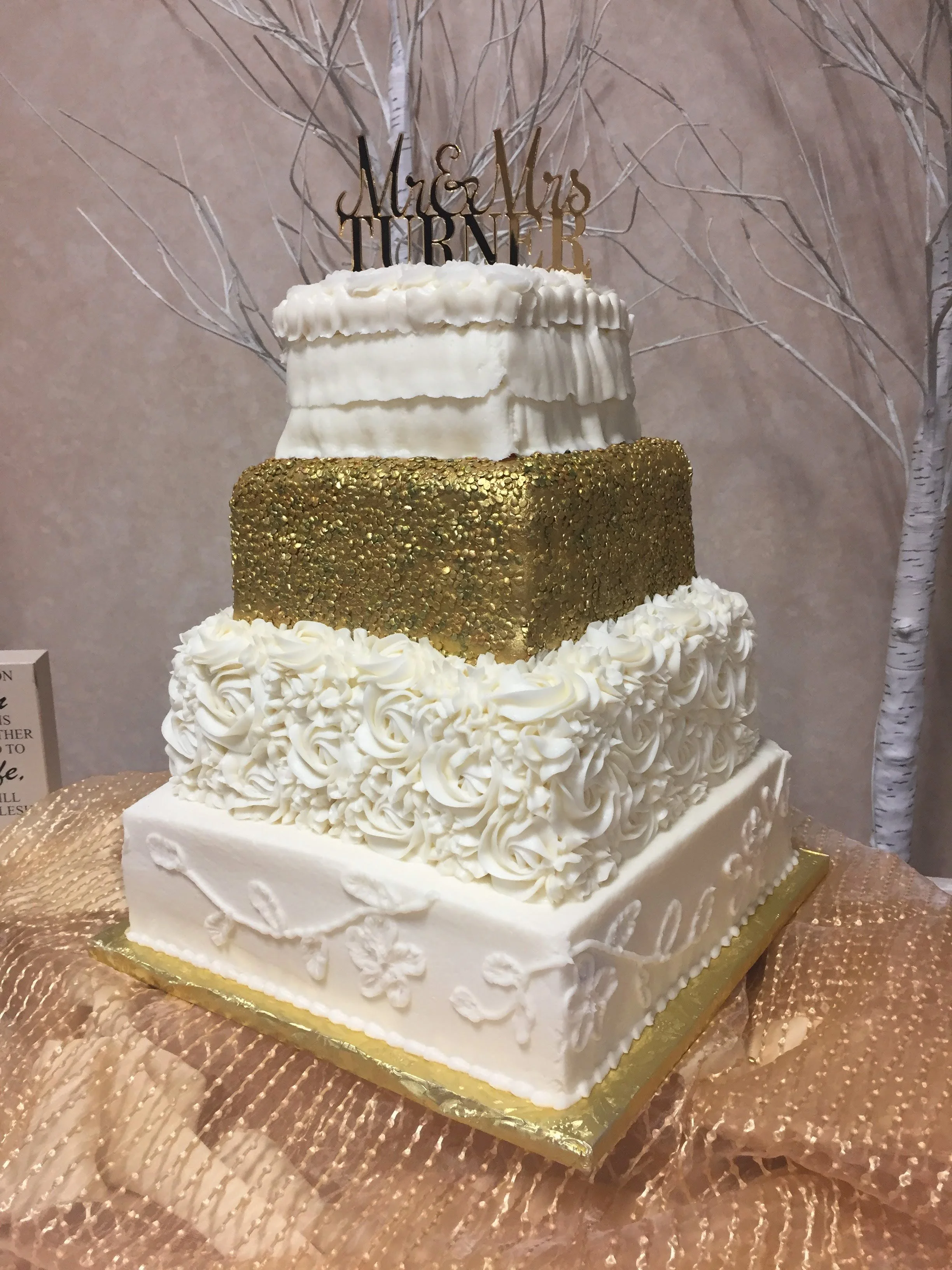 Buttercream cake with one fondant/candy sequin covered tier
