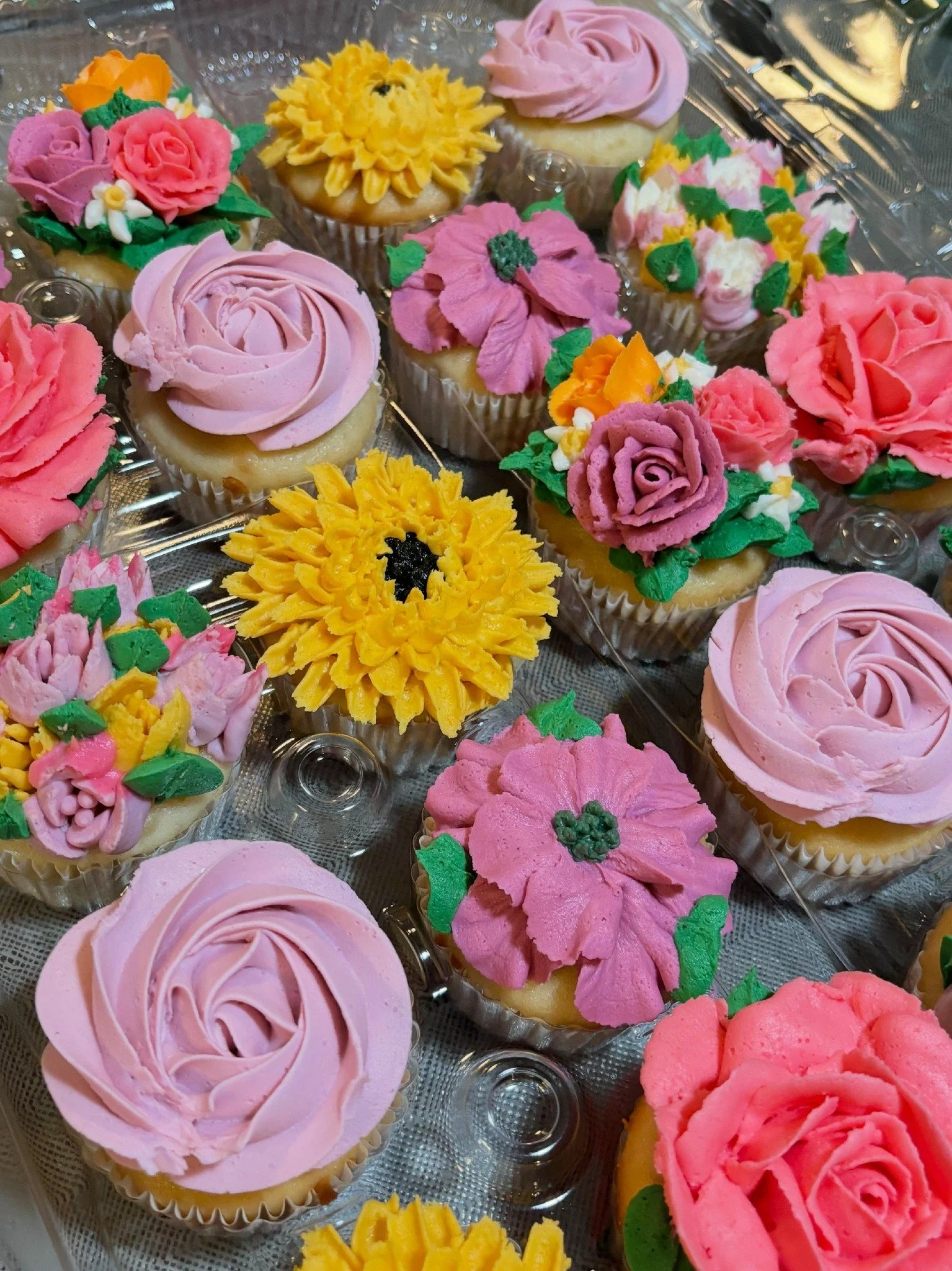 Hand-piped floral cupcakes with textured buttercream flowers