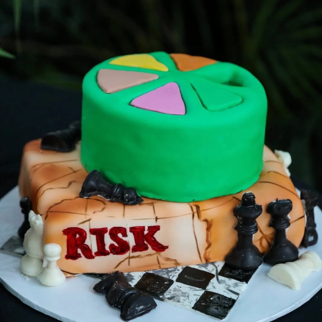 Board game themed grooms cake with game box, game pieces, and chess board