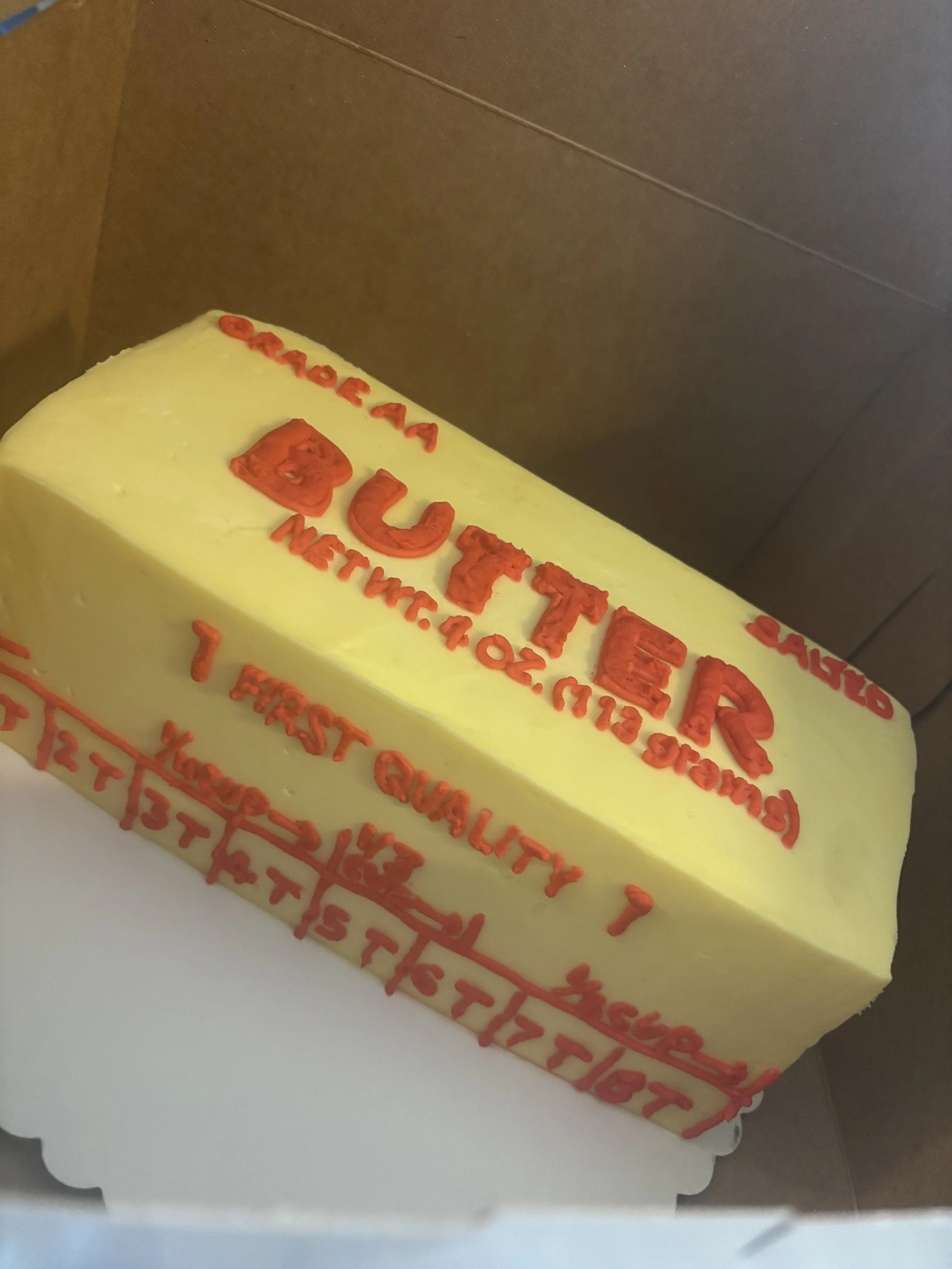 Realistic stick of butter cake designed as a playful food illusion cake.