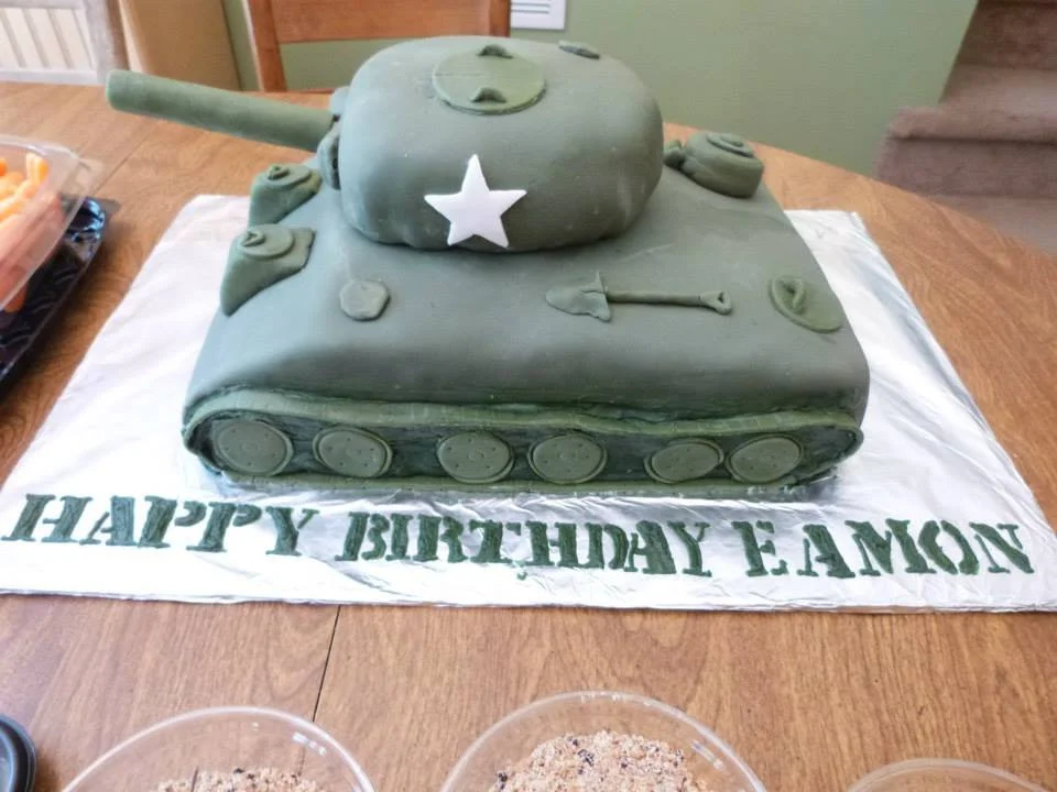 Detailed sculpted army tank cake for military themed celebration