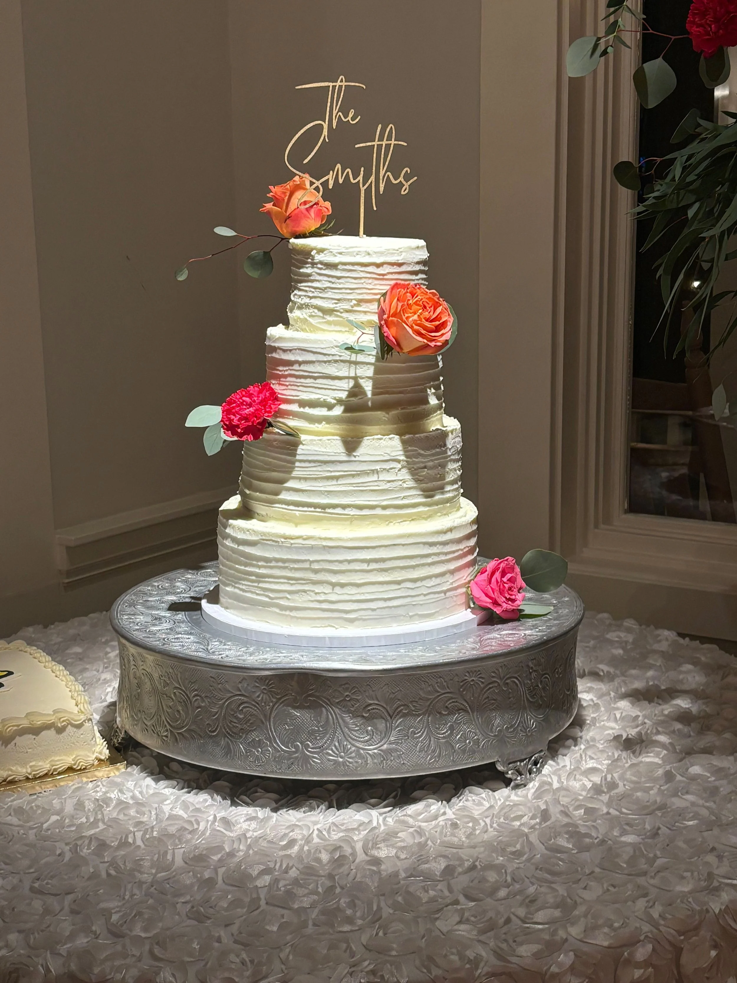 Four tiered rough iced wedding cake with real flowers - Norcross Georgia Custom Cake Bakery Flower Branch.jpg