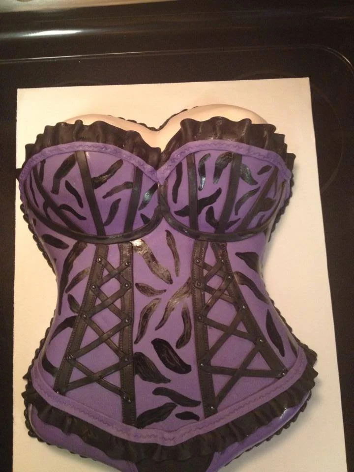 Sculpted purple lingerie cake designed for bachelorette party celebration