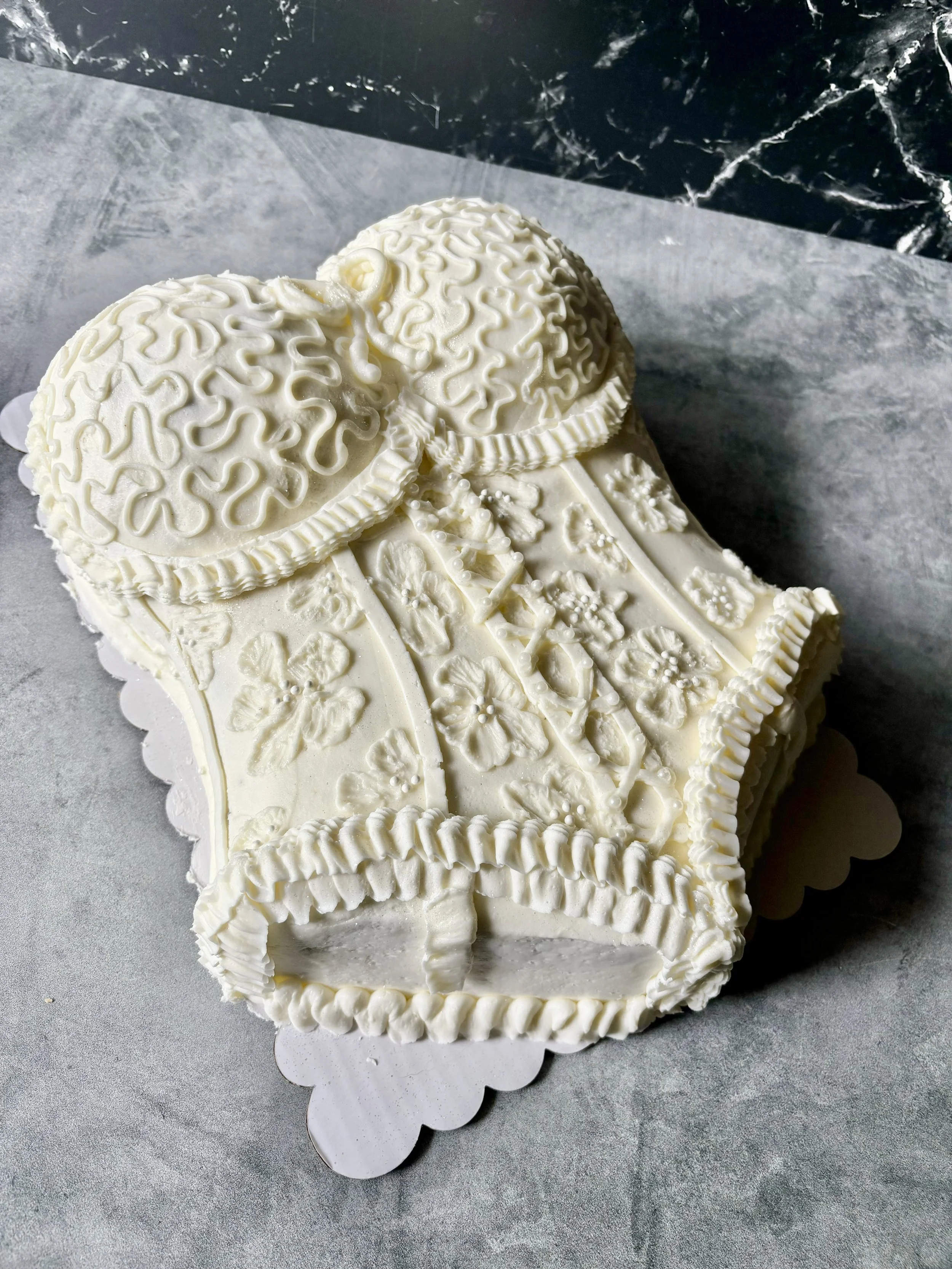 Elegant lace lingerie cake designed for a bridal shower.