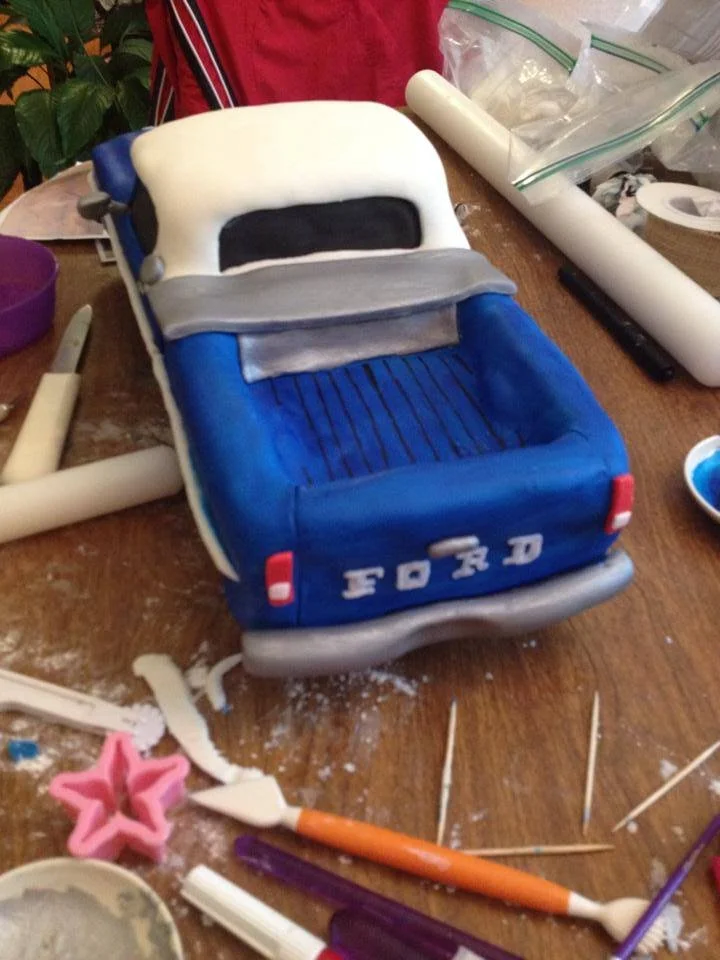 Vintage blue Ford truck sculpted cake for classic car lover