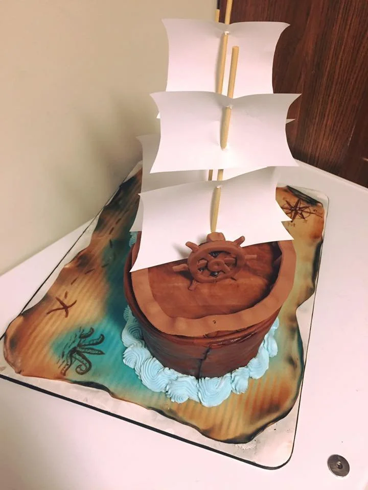 Three dimensional pirate ship cake with sails and wood texture
