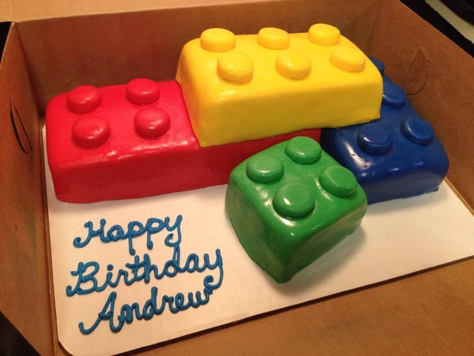 Colorful building block themed sculpted cake for child’s birthday celebration