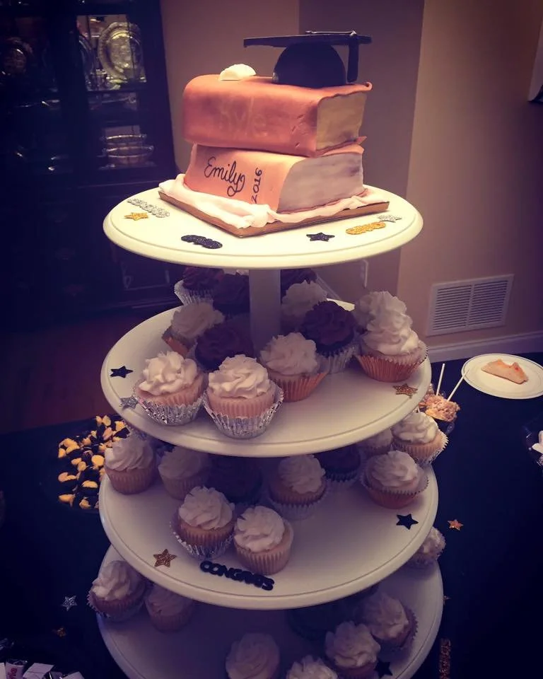 Stacked book cake topped with graduation cap for commencement celebration