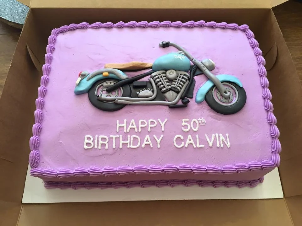 Three dimensional motorcycle cake with detailed engine and tire texture