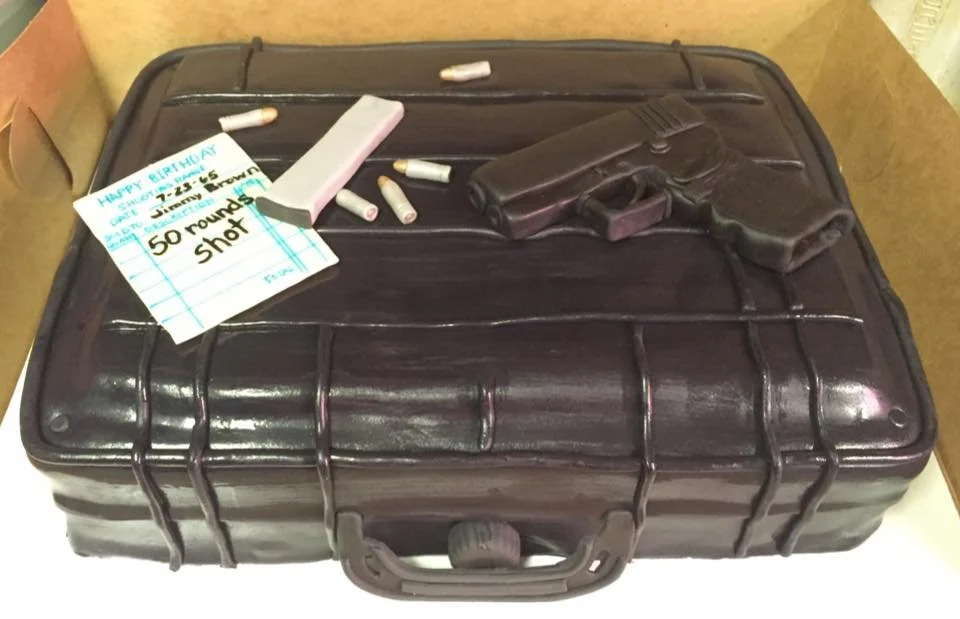 Gun case with a pistol and cartridges on top in Flowery Branch, Georgia