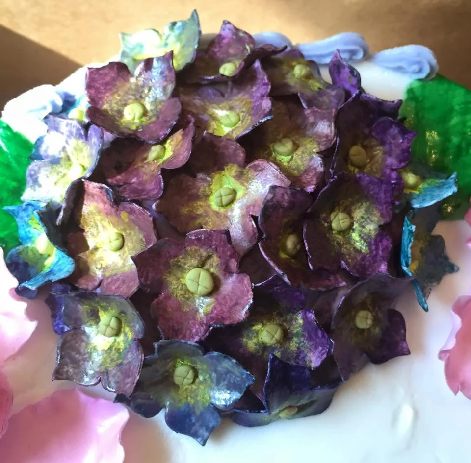 Handmade edible hydrangea flower on birthday cake