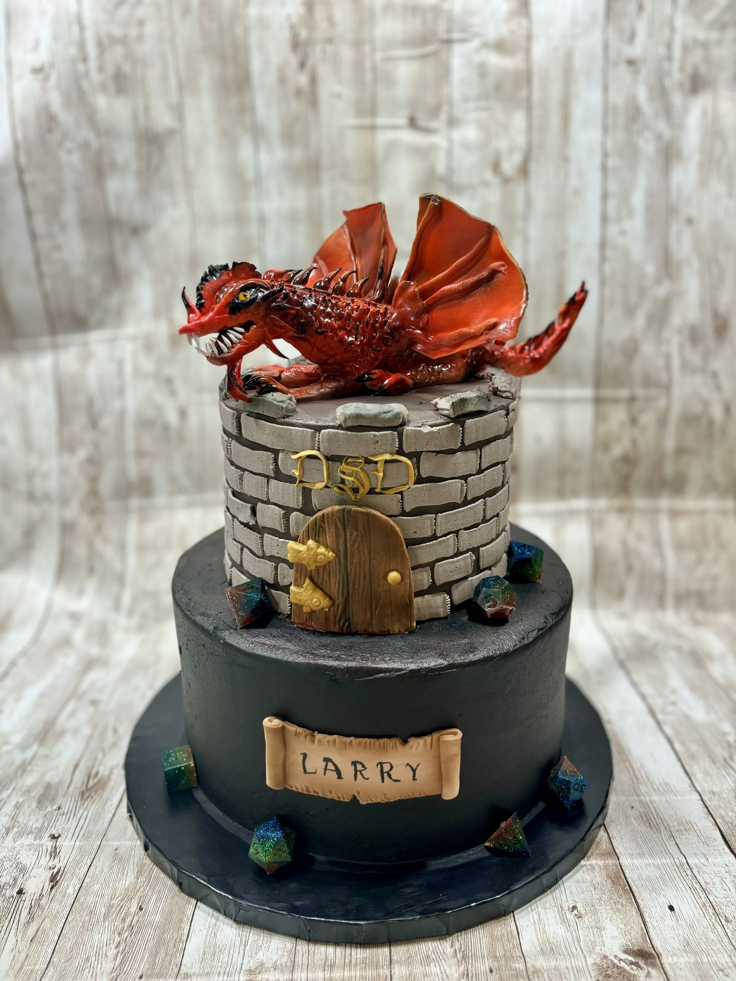 Dungeons & Dragons cake with castle, dragon, and gaming dice for a fantasy-themed celebration.
